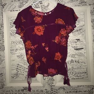 Floral dress shirt, says size ca fits as a small.